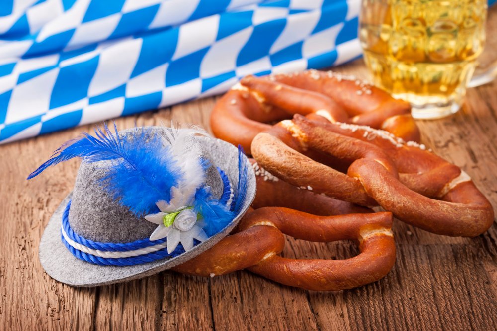 German bretzels and beer on wooden table