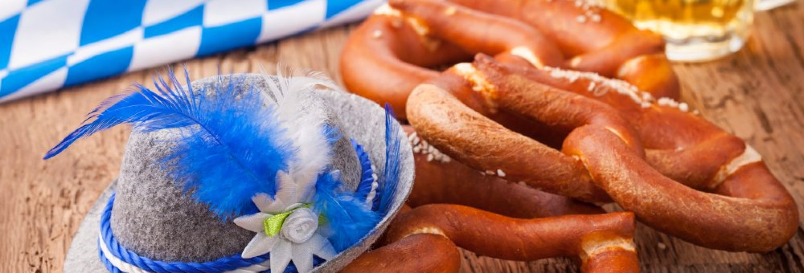 German bretzels and beer on wooden table